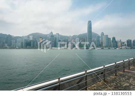 Hong Kong island. City skyline overlooks calm harbor waters 138130553