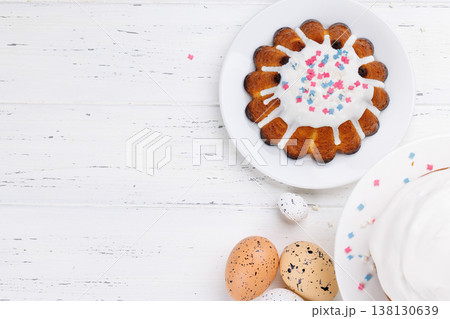 Traditional Easter cake decorated with colorful icing and sprinkles, symbolizing the festive spirit Traditional Easter cake decorated with colorful icing and sprinkles, symbolizing the festive spirit 138130639