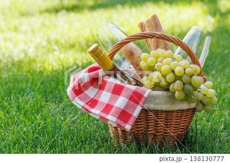 Picnic basket with wine, grapes, and baguette Picnic basket with wine, grapes, and baguette 138130777