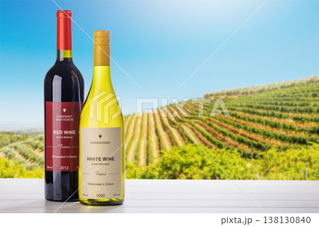 Wine bottles mockup in sunlit vineyard Wine bottles mockup in sunlit vineyard 138130840
