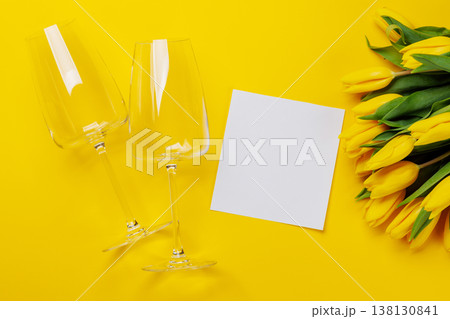 White wine glasses with yellow tulips White wine glasses with yellow tulips 138130841
