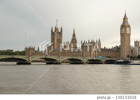 The Gothic Revival splendor of the Palace of Westminster dominates the horizon, its intricate spires and golden limestone facades reflected subtly in the undulating surface of the River Thames. The Gothic Revival splendor of the Palace of Westminster dominates the horizon, its intricate spires and golden limestone facades reflected subtly in the undulating surface of the River Thames. 138131016