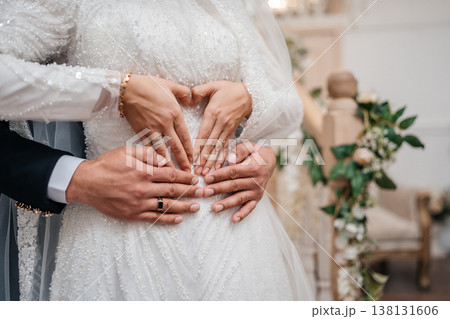 Multiple Hands Forming Heart Shape Over Waist, Layered Rings And Beaded Gown, Emotional Connection . Multiple Hands Forming Heart Shape Over Waist, Layered Rings And Beaded Gown, Emotional Connection . 138131606