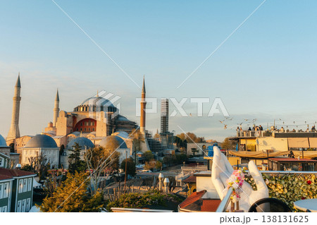 Sunlit Hagia Sophia Skyline At Sunrise, Rooftop Photographer Framing Historic Domes And Minarets, . Sunlit Hagia Sophia Skyline At Sunrise, Rooftop Photographer Framing Historic Domes And Minarets, . 138131625