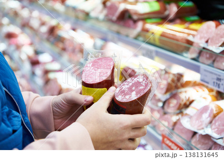 Sausage in hands buyer at shop Sausage in hands buyer at shop 138131645