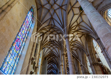 Interior view of Ulm Cathedral in Germany. Features ornate ceiling, detailed stone carvings, and stained glass windows. Gothic architecture highlights Interior view of Ulm Cathedral in Germany. Features ornate ceiling, detailed stone carvings, and stained glass windows. Gothic architecture highlights 138132073