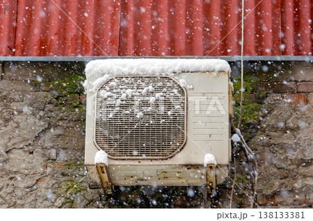 Air conditioner on roof during snow Air conditioner on roof during snow 138133381