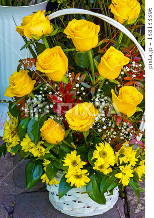Yellow roses in basket Yellow roses in basket 138133396