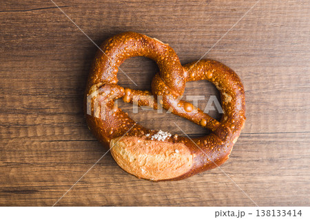 Salted German Pretzel On Rustic Wooden Table, Fresh Baked Bakery Bread Snack 138133414