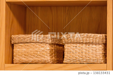 Rattan boxes on shelf 138133431