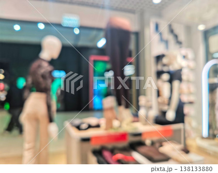 Blurred interior of a modern clothing store with mannequins Blurred interior of a modern clothing store with mannequins 138133880