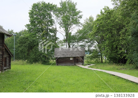 Serene woodland shelter accessible via winding trail and lush greenery 138133928