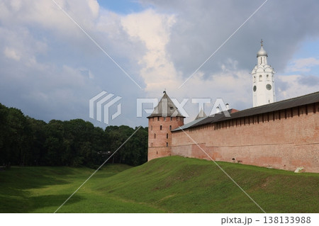 Old stone fortress with surrounding forest and reflective sky Old stone fortress with surrounding forest and reflective sky 138133988
