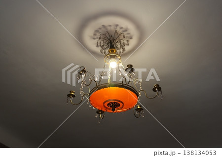 Decorative ceiling piece creates subtle shadows with cozy ambiance 138134053