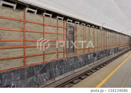 Vacant Underground Platform Scene. Abandoned Metro Platform With Tiled Walls And Bright Lighting Vacant Underground Platform Scene. Abandoned Metro Platform With Tiled Walls And Bright Lighting 138134086