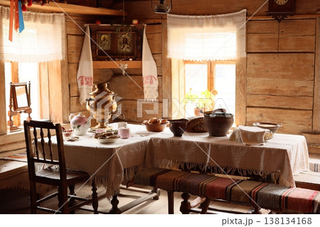 Warm communal space decorated with textiles and vintage furniture Warm communal space decorated with textiles and vintage furniture 138134168