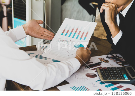 Businessman with graph, Growth Analysis, Charts on paper data finance business Presentation to the team Businessman with graph, Growth Analysis, Charts on paper data finance business Presentation to the team 138136060