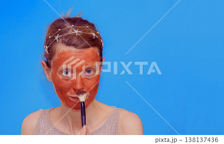 Female putting face mask Female putting face mask 138137436