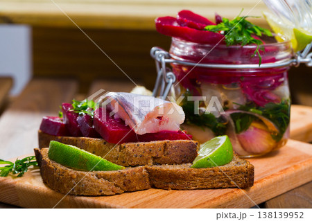Poutassou marinated, served at bread with beets, onions and marinade from lime juice Poutassou marinated, served at bread with beets, onions and marinade from lime juice 138139952