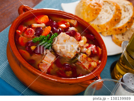 Bean's cooked with pork, boiled carrots and greens, served Bean's cooked with pork, boiled carrots and greens, served 138139989