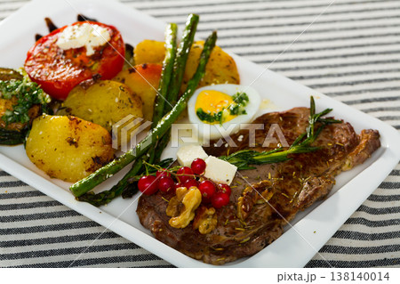 Veal with baked vegetables is tasty dish Veal with baked vegetables is tasty dish 138140014