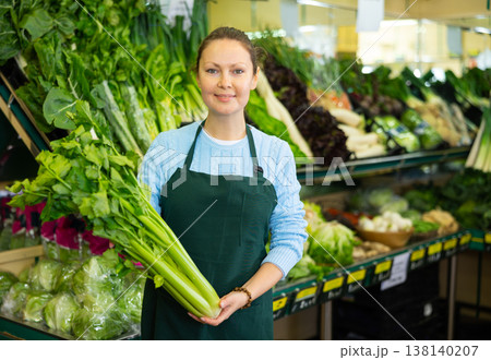 woman seller offers to buy celery woman seller offers to buy celery 138140207