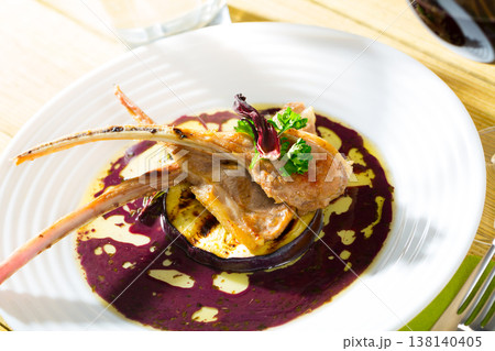 Baked lamb ribs with golden crust 138140405