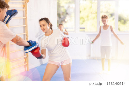 Man and woman training boxing in studio 138140614