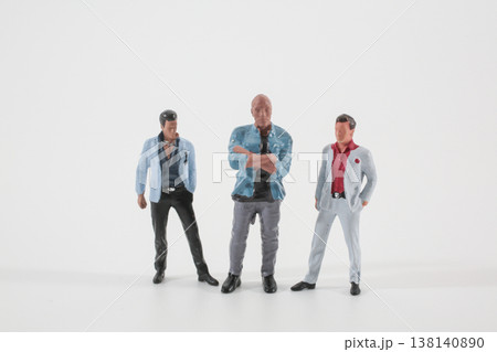 Three Miniature Figures Standing Together in Studio Scene Three Miniature Figures Standing Together in Studio Scene 138140890