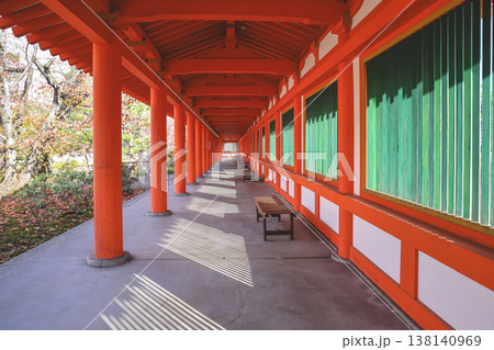Red Colonnade Walkway With Green Shutter Windows Nov 28 2025 138140969