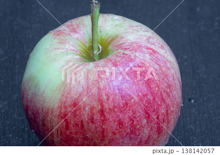 red apple, close-up, on a wooden background. 138142057