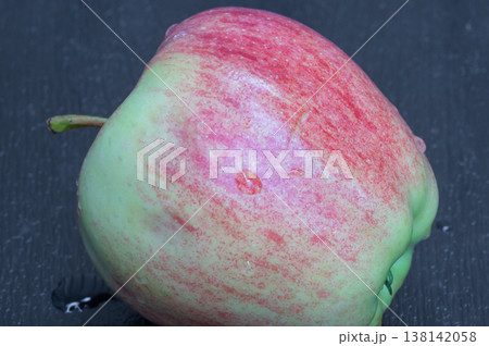 red apple, close-up, on a wooden background. 138142058