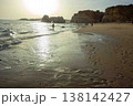 Golden hour idyllic vacation beach scene Algarve Portugal Praia do Amado 138142427