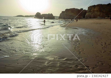 Golden hour idyllic vacation beach scene Algarve Portugal Praia do Amado Golden hour idyllic vacation beach scene Algarve Portugal Praia do Amado 138142427