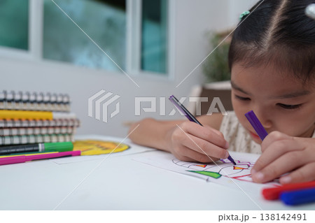 Child Engaged in Drawing Activity at Home 138142491