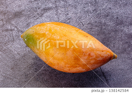 Two ripe tropical mango fruits on a rustic background Two ripe tropical mango fruits on a rustic background 138142584