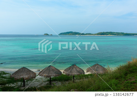 Beautiful Andaman sea, Tropical Turquoise clear blue sea and white sand beach on pattaya beach with blue sky background - summer vacation travel. at Tarutao national park and Koh Lipe in Satun, Beautiful Andaman sea, Tropical Turquoise clear blue sea and white sand beach on pattaya beach with blue sky background - summer vacation travel. at Tarutao national park and Koh Lipe in Satun, 138142677