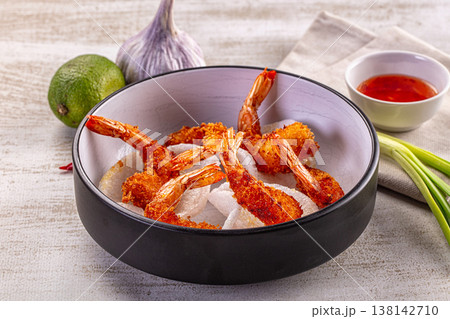Crispy fried panko shrimp in a bowl with sweet chili sauce and fresh ingredients Crispy fried panko shrimp in a bowl with sweet chili sauce and fresh ingredients 138142710