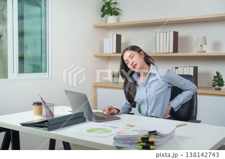 Office syndrome with back pain at desk 138142743