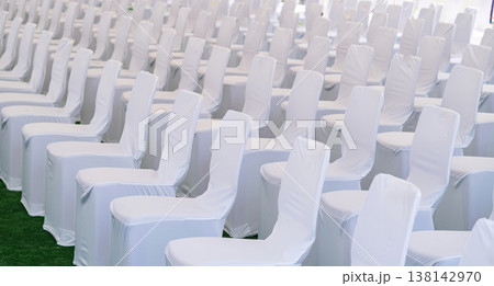 Large scale seating setup with many chairs prepared for an audience in a big event or conference environment. Large scale seating setup with many chairs prepared for an audience in a big event or conference environment. 138142970