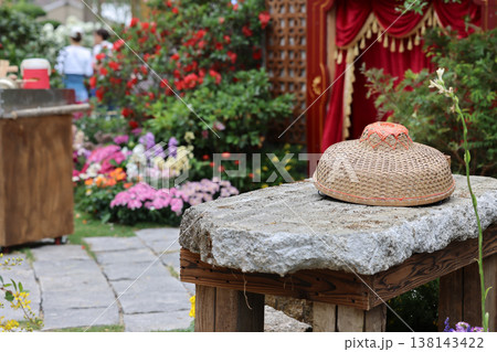 March 21 2026 Traditional woven bamboo hat resting on stone surface March 21 2026 Traditional woven bamboo hat resting on stone surface 138143422