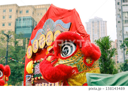 March 21 2026 Vibrant red lion dance costume displayed before festive backdrop March 21 2026 Vibrant red lion dance costume displayed before festive backdrop 138143489