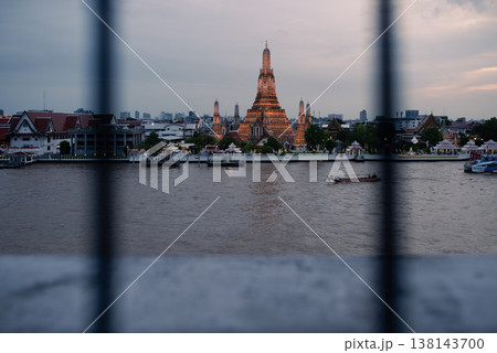 Bangkok, Thailand - June 11, 2025: Pagoda at Wat Arun, or Wat Arun Ratchawararam, is a tourist landmark near the Chao Phraya River in Bangkok,Thailand. Bangkok, Thailand - June 11, 2025: Pagoda at Wat Arun, or Wat Arun Ratchawararam, is a tourist landmark near the Chao Phraya River in Bangkok,Thailand. 138143700