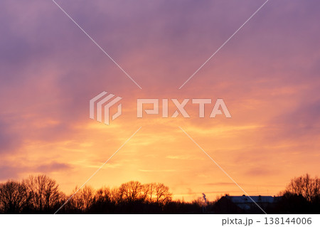 Stunning natural phenomenon: Golden hour sky in fiery orange and vibrant violet tones Stunning natural phenomenon: Golden hour sky in fiery orange and vibrant violet tones 138144006