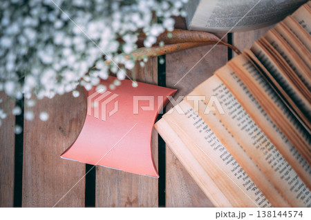 Top View Wedding Favor Box Mockup with Vintage Book and Baby's Breath 138144574