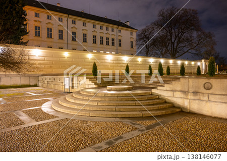 The circular staircase at Prague Castle provides access to different levels. Designed by architect Josip Plecnik, it features smooth stone steps. The setting is well lit at night. 138146077