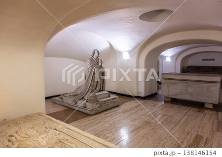 Visitors can see the tombs of Pius VI in the crypt of St. Peters Basilica. The area includes a statue of the Pope and several ornate tombs. The setting is quiet and historic. 138146154