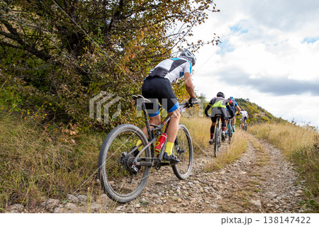 Group mountain bikers racing Group mountain bikers racing 138147422