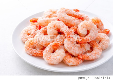 Frozen peeled shrimp on plate close up seafood texture 138151613