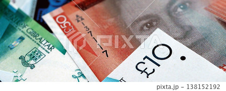 Gibraltar pound paper banknotes pile on table....の写真素材 [138152192] - PIXTA